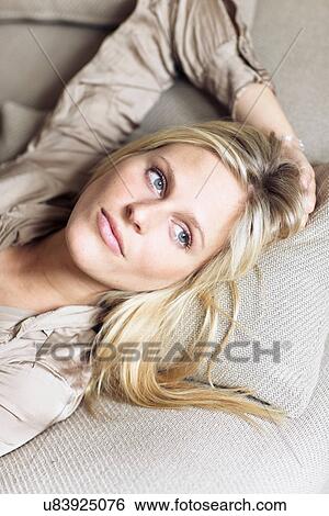 Stock Photograph - Woman daydreaming in bed. Fotosearch