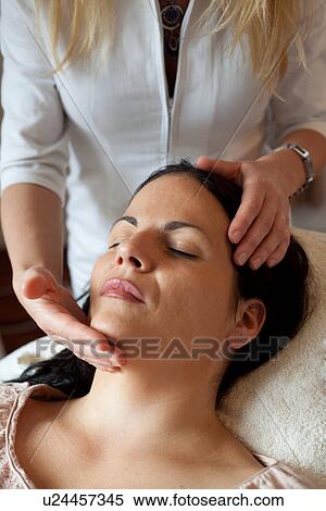 Stock Photography - Woman having facial treatment. Fotosearch