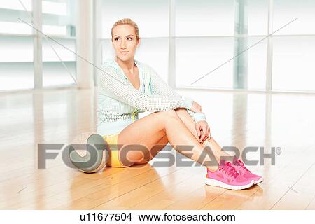 Woman in gym with ball View Large Photo Image Picture - Woman in gym with ball. Fotosearch