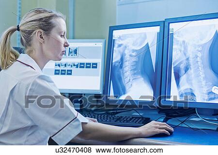 Woman performing x-ray View Large Photo Image Stock Photo - Woman performing x-ray. Fotosearch