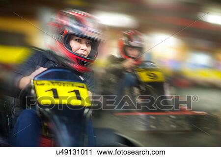 Woman racing in go cart View Large Photo Image Stock Image - Woman racing in go cart. Fotosearch