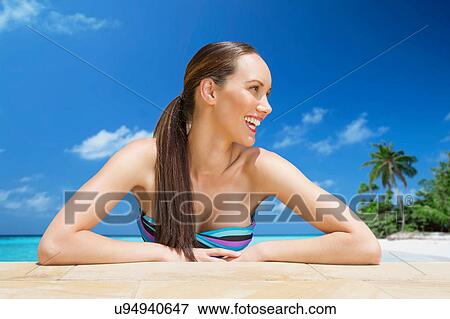 Woman relaxing at the beach View Large Photo Image Stock Photo - Woman relaxing at the beach. Fotosearch
