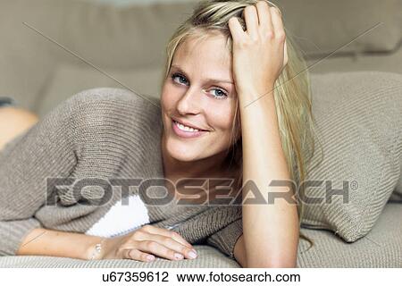 Woman resting head on hand View Large Photo Image Stock Image - Woman resting head on hand. Fotosearch