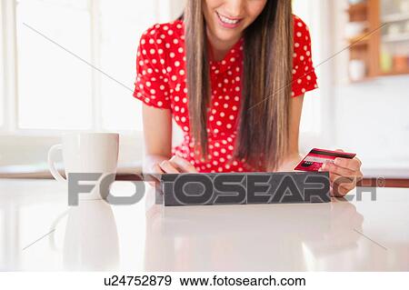 Woman shopping online View Large Photo Image Stock Photo - Woman shopping online. Fotosearch