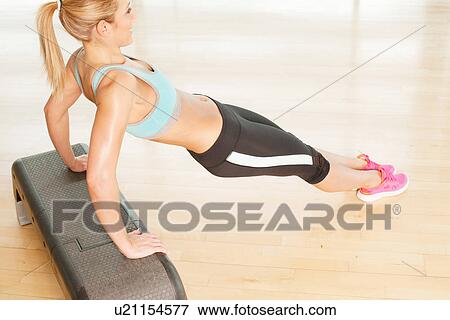 Woman stretching on step View Large Photo Image Stock Photo - Woman stretching on step. Fotosearch