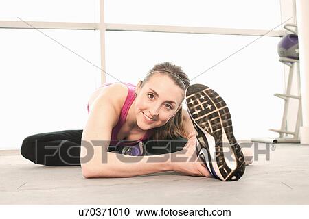 Woman stretching warming up View Large Photo Image Stock Image - Woman stretching warming up. Fotosearch