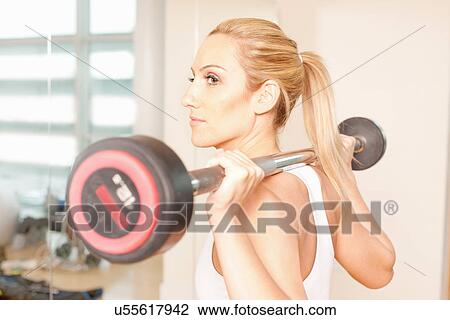 Woman weight-lifting View Large Photo Image Stock Image - Woman weight-lifting. Fotosearch