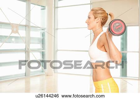 Woman weight-lifting View Large Photo Image Stock Photograph - Woman weight-lifting. Fotosearch