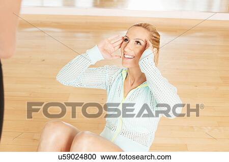 Women doing sit-ups View Large Photo Image Stock Image - Women doing sit-ups. Fotosearch