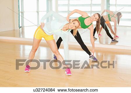 Women stretching in gymnasium View Large Photo Image Picture - Women stretching in gymnasium. Fotosearch
