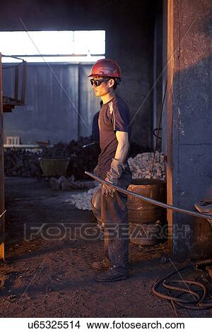 Working in cast iron foundry View Large Photo Image Picture - Working in cast iron foundry. Fotosearch
