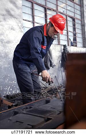 Working in cast iron foundry View Large Photo Image Stock Image - Working in cast iron foundry. Fotosearch