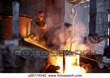 Working in cast iron foundry View Large Photo Image Stock Image - Working in cast iron foundry. Fotosearch