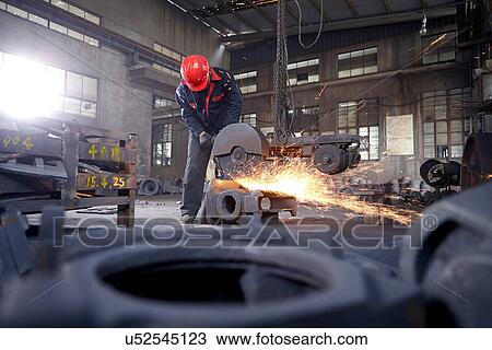 Stock Image - Working in cast iron foundry. Fotosearch