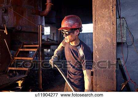 Stock Photo - Working in cast iron foundry. Fotosearch