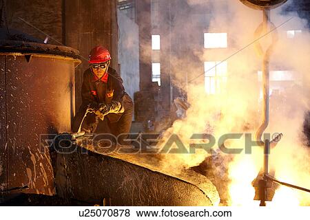 Stock Photo - Working in cast iron foundry. Fotosearch