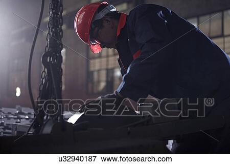 Working in cast iron foundry View Large Photo Image Stock Photo - Working in cast iron foundry. Fotosearch