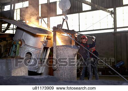 Stock Photo - Working in cast iron foundry. Fotosearch