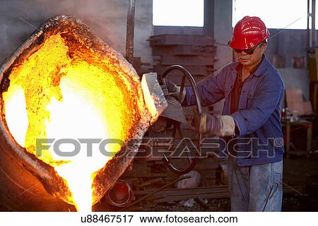 Stock Photo - Working in cast iron foundry. Fotosearch
