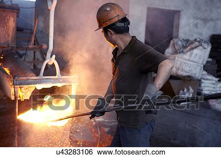 Working in cast iron foundry View Large Photo Image Stock Photograph - Working in cast iron foundry. Fotosearch