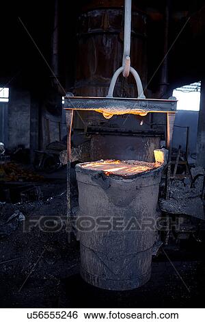 Stock Photograph - Working in cast iron foundry. Fotosearch