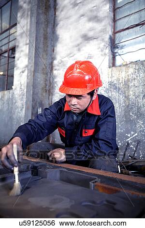 Working in cast iron foundry View Large Photo Image Stock Photograph - Working in cast iron foundry. Fotosearch