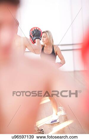 Young adults training in gym View Large Photo Image Stock Photo - Young adults training in gym. Fotosearch