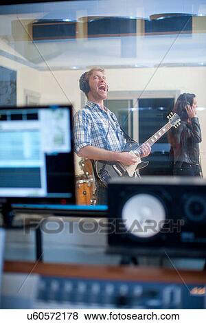 Young band playing in studio View Large Photo Image Stock Photo - Young band playing in studio. Fotosearch