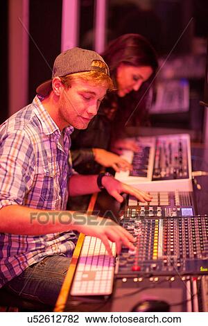Young man and woman in college recording studio View Large Photo Image Stock Image - Young man and woman in college recording studio. Fotosearch
