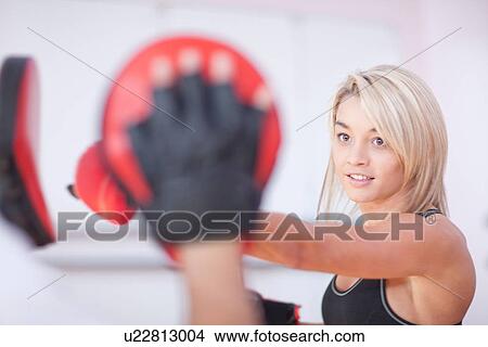 Young woman boxing in gym View Large Photo Image Picture - Young woman boxing in gym. Fotosearch