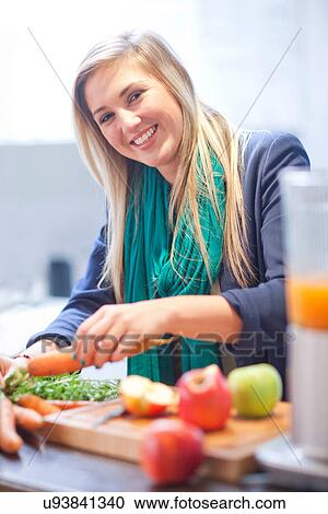 Young woman preparing juice drink View Large Photo Image Stock Image - Young woman preparing juice drink. Fotosearch