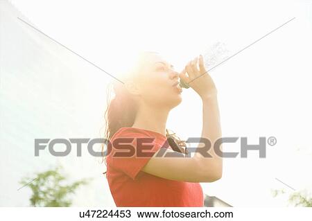 Young woman taking a break from training View Large Photo Image Stock Image - Young woman taking a break from training. Fotosearch