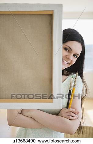 Art college student in front of canvas View Large Photo Image Stock Image - Art college student in front of canvas. Fotosearch