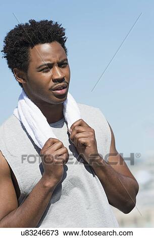 Athlete with towel on neck View Large Photo Image Stock Image - Athlete with towel on neck. Fotosearch