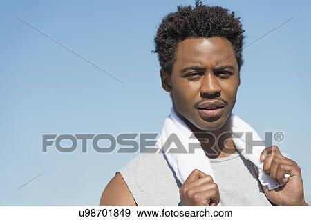 Athlete with towel on neck View Large Photo Image Stock Photo - Athlete with towel on neck. Fotosearch