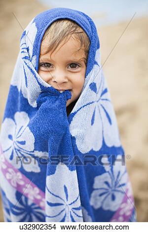 Baby girl (2-3) wrapped in towel on beach View Large Photo Image Picture - Baby girl (2-3) wrapped in towel on beach. Fotosearch
