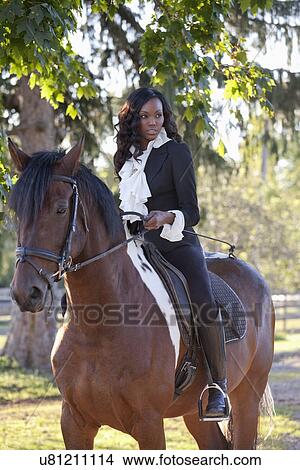 Beautiful woman horseriding View Large Photo Image Picture - Beautiful woman horseriding. Fotosearch