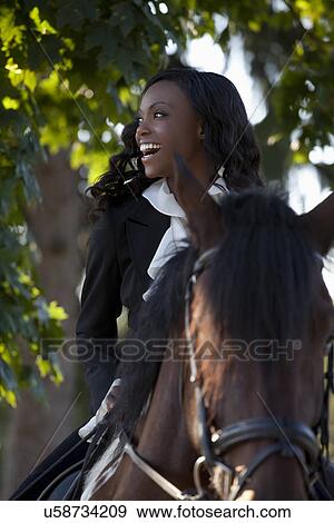 Beautiful woman horseriding View Large Photo Image Stock Photo - Beautiful woman horseriding. Fotosearch