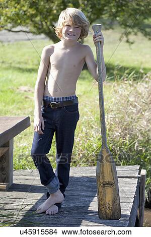 Picture - Boy (10-11) with oar. Fotosearch