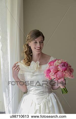Bride holding bouquet View Large Photo Image Stock Image - Bride holding bouquet. Fotosearch