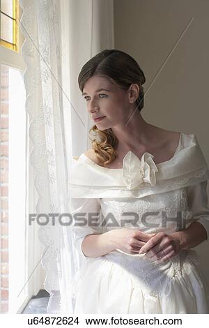 Picture - Bride looking out window. Fotosearch