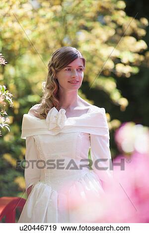Stock Photo - Bride posing outdoors. Fotosearch