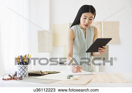 Business woman using tablet pc View Large Photo Image Stock Image - Business woman using tablet pc. Fotosearch
