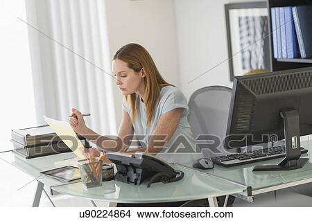 Business woman working in office View Large Photo Image Picture - Business woman working in office. Fotosearch