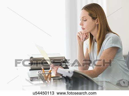 Business woman working in office View Large Photo Image Stock Image - Business woman working in office. Fotosearch
