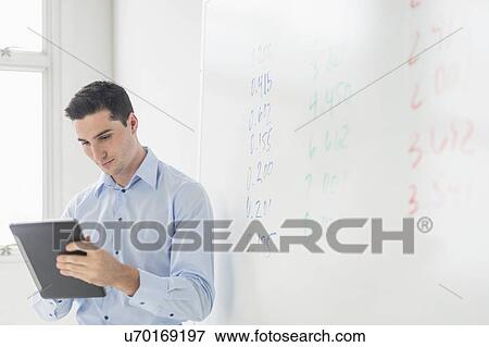 Businessman giving presentation View Large Photo Image Stock Photo - Businessman giving presentation. Fotosearch