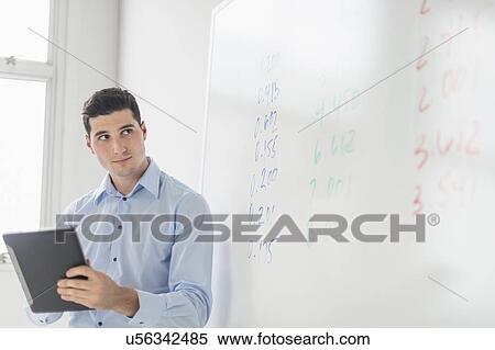 Businessman giving presentation View Large Photo Image Stock Photography - Businessman giving presentation. Fotosearch