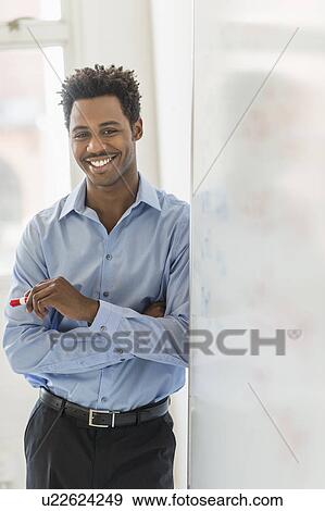 Businessman writing on whiteboard View Large Photo Image Stock Photo - Businessman writing on whiteboard. Fotosearch