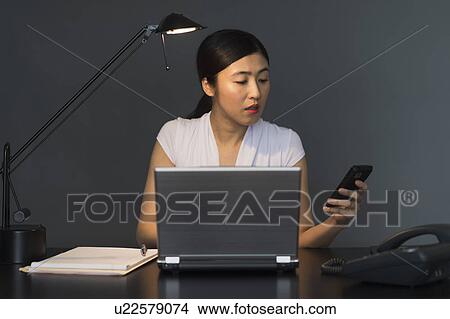 Businesswoman at work View Large Photo Image Picture - Businesswoman at work. Fotosearch