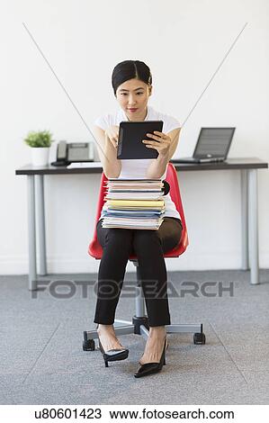 Businesswoman using tablet pc View Large Photo Image Stock Image - Businesswoman using tablet pc. Fotosearch